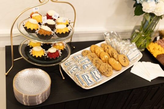 A tray displaying custom Rinehart Bryant logo cookies and other refreshments from Pattycakes and Cookies.